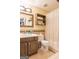 Cozy bathroom featuring a toilet, shower with curtain, vanity, and shelving for storage at 402 Stonebrooke Dr, Auburn, GA 30011