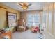 Sun-filled bedroom with neutral walls, carpet floors and a large window at 402 Stonebrooke Dr, Auburn, GA 30011