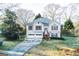 Exterior view of home with a long driveway and traditional design at 402 Stonebrooke Dr, Auburn, GA 30011