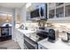Contemporary kitchen showcasing stainless steel appliances and ample countertop space at 402 Stonebrooke Dr, Auburn, GA 30011