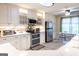 Fully-equipped kitchen showcasing a double oven, and stainless steel appliances at 402 Stonebrooke Dr, Auburn, GA 30011