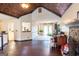 Open-concept living room with hardwood floors, a unique ceiling and seamless flow to adjoining spaces at 402 Stonebrooke Dr, Auburn, GA 30011