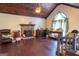 Bright living room with hardwood floors, a stone fireplace, and lots of natural light at 402 Stonebrooke Dr, Auburn, GA 30011
