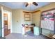 Versatile office space with neutral paint, window, and a modern ceiling fan at 402 Stonebrooke Dr, Auburn, GA 30011