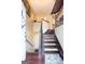 View of the staircase featuring hardwood treads leading to the second story of this home at 402 Stonebrooke Dr, Auburn, GA 30011
