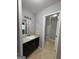 Bathroom with granite vanity and a tiled floor adjacent to the shower at 7560 Taylor Rd # 1, Riverdale, GA 30274