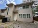 Two-story house features a neutral exterior and a well-maintained front yard at 7560 Taylor Rd # 1, Riverdale, GA 30274