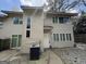 Two-story house features a neutral exterior and a well-maintained front yard at 7560 Taylor Rd # 1, Riverdale, GA 30274