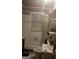 Bathroom featuring white tile, with some pink and black accents, with a shower, sink, and toilet at 212 Little Se St, Atlanta, GA 30315