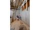 Unfinished basement features a concrete wall and a water shutoff valve at 2009 Parador Aly, Mcdonough, GA 30253