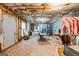 Unfinished basement with exposed ceiling, paint splattered floor and art supplies at 2009 Parador Aly, Mcdonough, GA 30253