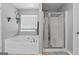 Bright bathroom with a large soaking tub, separate shower, and natural light from the window at 2009 Parador Aly, Mcdonough, GA 30253