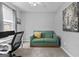 Bright office space featuring a comfortable sofa and a workspace with natural light at 2009 Parador Aly, Mcdonough, GA 30253