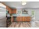 Charming kitchen with stainless steel appliances, wood cabinets, and a decorative blue backsplash at 2009 Parador Aly, Mcdonough, GA 30253