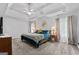 Spacious main bedroom with tray ceiling, modern ceiling fan, and large windows at 2009 Parador Aly, Mcdonough, GA 30253
