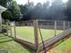View of a fenced backyard featuring a well-maintained lawn, offering security and space for outdoor activities at 3025 Ebenezer Rd., Se Rd, Conyers, GA 30094
