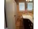 Retro bathroom with patterned wallpaper, peach tile, and a shower-tub combination at 3025 Ebenezer Rd., Se Rd, Conyers, GA 30094