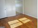 Bright and airy bedroom featuring hardwood floors and a mirrored closet at 3025 Ebenezer Rd., Se Rd, Conyers, GA 30094