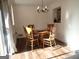 Bright dining room with wood floors and a classic chandelier at 3025 Ebenezer Rd., Se Rd, Conyers, GA 30094