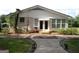 Quaint exterior view showcasing a charming home with unique architectural details and landscaped pathway at 3025 Ebenezer Rd., Se Rd, Conyers, GA 30094