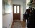 Foyer with wood-look flooring, a decorative rug, and coat hooks at 3025 Ebenezer Rd., Se Rd, Conyers, GA 30094