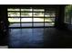 Well lit garage with glass panel garage door and view of front yard and driveway at 3025 Ebenezer Rd., Se Rd, Conyers, GA 30094