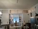 View of kitchen cabinets with peek-through window to eat-in area at 3025 Ebenezer Rd., Se Rd, Conyers, GA 30094