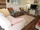 Bright living room with light wood floors, TV, and stylish seating at 3025 Ebenezer Rd., Se Rd, Conyers, GA 30094