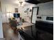 Living room adjacent to kitchen with hardwood floors and neutral paint at 3025 Ebenezer Rd., Se Rd, Conyers, GA 30094