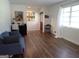 Open living room with laminate flooring and view of front door at 3025 Ebenezer Rd., Se Rd, Conyers, GA 30094