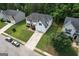 An aerial view shows the home's well-maintained lawn, driveway, two-car garage, and attractive neighborhood at 3205 Anneewakee Falls Pkwy, Douglasville, GA 30135