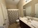 Bathroom with vanity, toilet, shower-tub combo, and neutral tones at 3205 Anneewakee Falls Pkwy, Douglasville, GA 30135