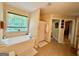Bathroom featuring a soaking tub and window, as well as a separate shower at 3205 Anneewakee Falls Pkwy, Douglasville, GA 30135