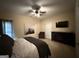 Bedroom has neutral decor, carpet, and TV on the dresser at 3205 Anneewakee Falls Pkwy, Douglasville, GA 30135