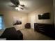 Bedroom featuring a ceiling fan, dresser, and an art piece above a chair at 3205 Anneewakee Falls Pkwy, Douglasville, GA 30135