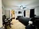 A modern bedroom featuring a king-sized bed, a ceiling fan, and a closet with built-in storage at 3205 Anneewakee Falls Pkwy, Douglasville, GA 30135