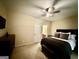 Comfortable bedroom featuring neutral tones, ceiling fan, and plush bedding at 3205 Anneewakee Falls Pkwy, Douglasville, GA 30135