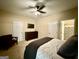 Bright bedroom with ensuite bathroom and ceiling fan at 3205 Anneewakee Falls Pkwy, Douglasville, GA 30135