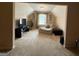 A spacious bonus room featuring comfortable seating, neutral carpet, and a large TV at 3205 Anneewakee Falls Pkwy, Douglasville, GA 30135