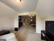 Spacious bonus room with neutral carpet and a large TV, leading into the main bedroom area at 3205 Anneewakee Falls Pkwy, Douglasville, GA 30135