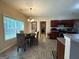 Bright breakfast nook area with a round table, wicker chairs, and a view of the backyard at 3205 Anneewakee Falls Pkwy, Douglasville, GA 30135