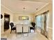 Formal dining room featuring neutral walls, carpet, and a modern table with a pendant light fixture at 3205 Anneewakee Falls Pkwy, Douglasville, GA 30135