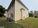 View of the side and rear of the house, highlighting its design and features at 3205 Anneewakee Falls Pkwy, Douglasville, GA 30135