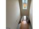Bright foyer featuring an entry door, hardwood floors and an ornate light fixture at 3205 Anneewakee Falls Pkwy, Douglasville, GA 30135
