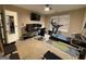 Well-lit home gym with a treadmill, multiple monitors, and fitness accessories at 3205 Anneewakee Falls Pkwy, Douglasville, GA 30135