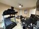 Bright home gym with treadmill, workout desk, exercise equipment, and ceiling fan at 3205 Anneewakee Falls Pkwy, Douglasville, GA 30135