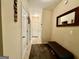 Hallway with neutral paint, and a mirror hanging on the wall at 3205 Anneewakee Falls Pkwy, Douglasville, GA 30135