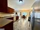 Open kitchen featuring a breakfast nook, stainless steel appliances, and dark cabinetry at 3205 Anneewakee Falls Pkwy, Douglasville, GA 30135