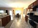 Open kitchen features a breakfast nook, stainless steel appliances, and dark cabinetry at 3205 Anneewakee Falls Pkwy, Douglasville, GA 30135