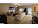 Comfortable living room with fireplace, TV, sofa, ottoman, and chair at 3205 Anneewakee Falls Pkwy, Douglasville, GA 30135